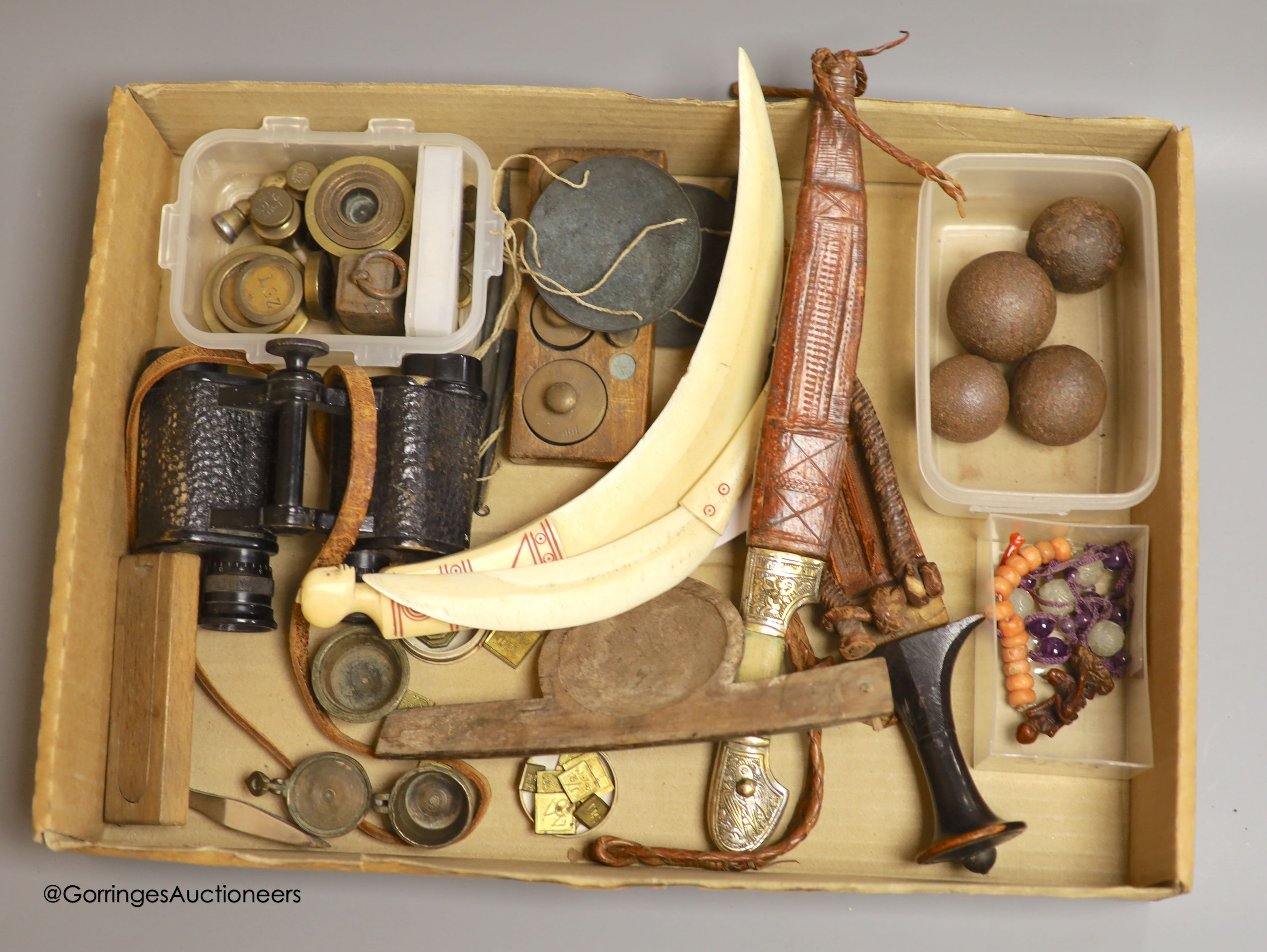 Four shot balls, two daggers, various weights, a pair of binoculars and Chinese hardstone cameo beads etc
